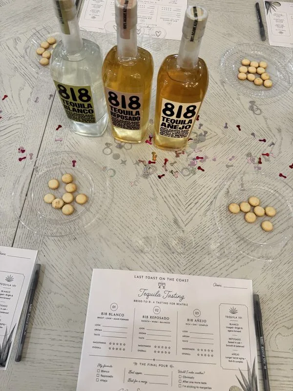A bride-to-be tequila tasting with blanco, reposado and añejo bottles and custom tasting cards
